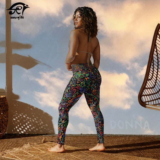 Woman wearing the DONNA black Yoga Leggings, with a Sunset on her background